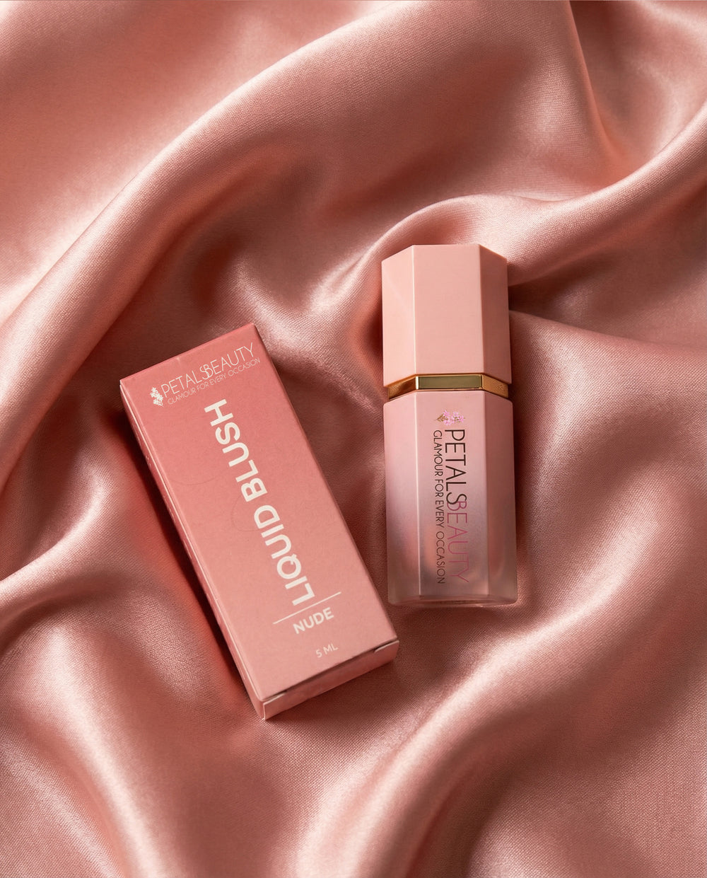 Nude liquid blush bottle open, showing the sponge-tip applicator and soft nude formula