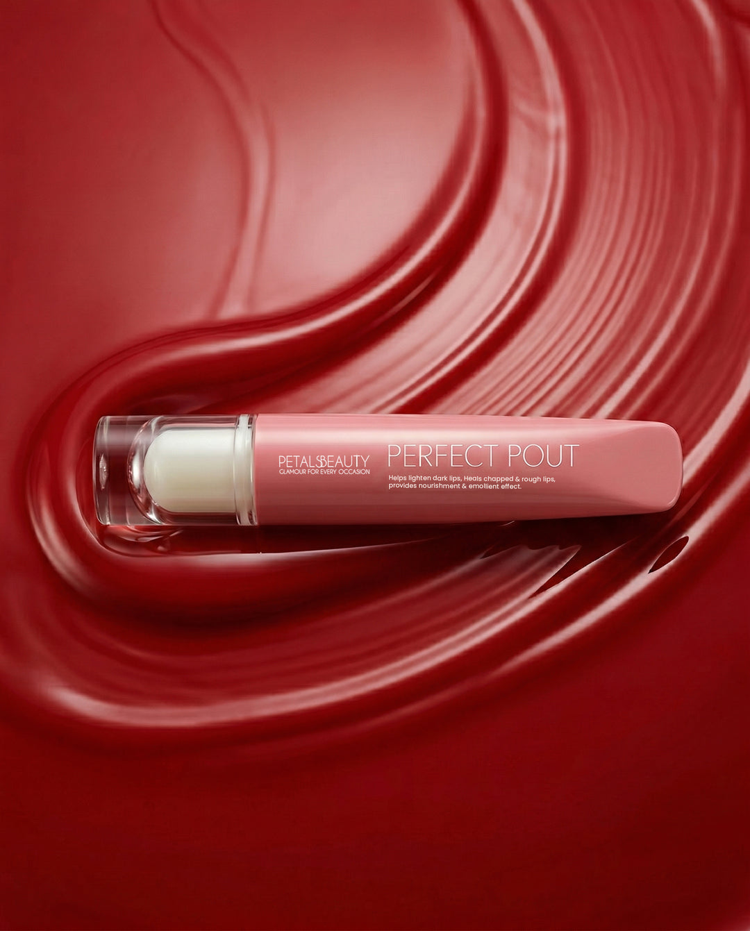 Red Ruby lip gloss with doe-foot applicator showing glossy ruby-red color