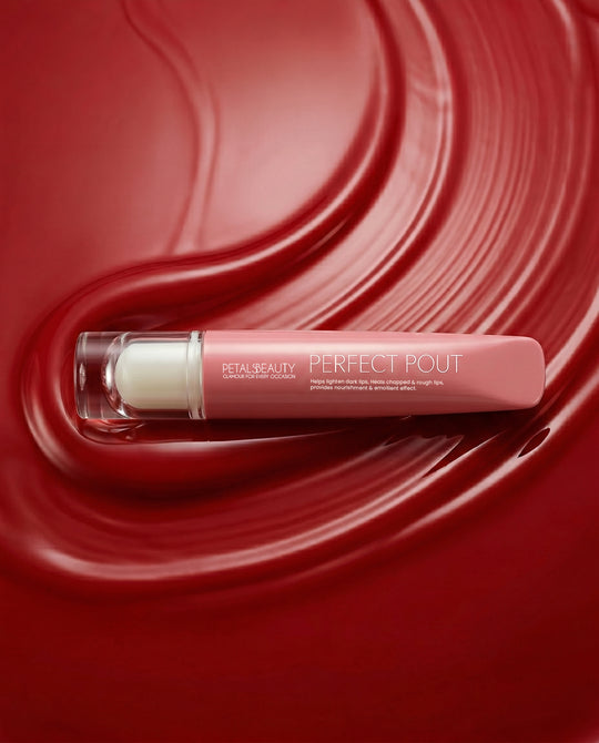 Red Ruby lip gloss with doe-foot applicator showing glossy ruby-red color